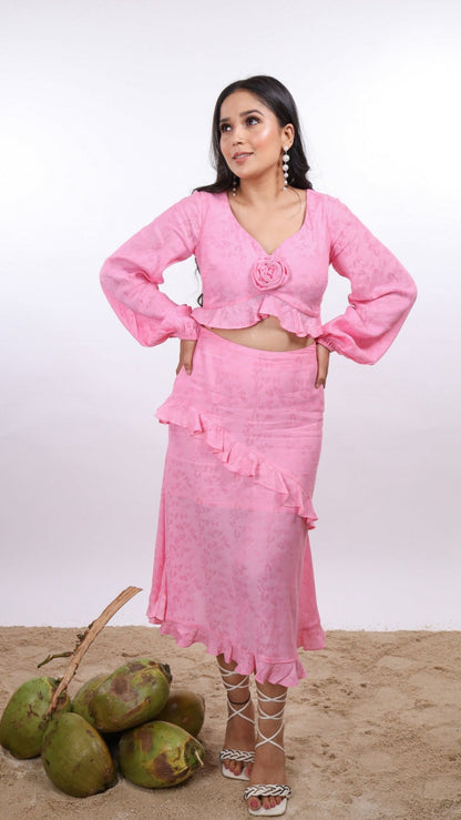 Pink Amelia Skirt – effortlessly chic resort wear for women, featuring flattering midi length, diagonal ruffles, hem frill, and side zipper. Made in soft viscose jacquard - floral pattern fabric, Lined with soft cotton cambric for comfort. Perfect for beach vacations, sunset dinners, and summer getaways.