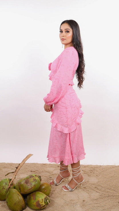 Pink Amelia Skirt – effortlessly chic resort wear for women, featuring flattering midi length, diagonal ruffles, hem frill, and side zipper. Made in soft viscose jacquard - floral pattern fabric, Lined with soft cotton cambric for comfort. Perfect for beach vacations, sunset dinners, and summer getaways.