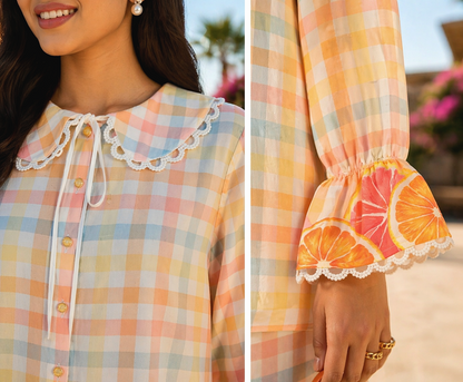 Close up of peter pan collar with scallop lace detailing on citrus print cotton shirt & Sleeve detail of cotton shirt with lace edging and soft elastic cuff in citrus co-ord set