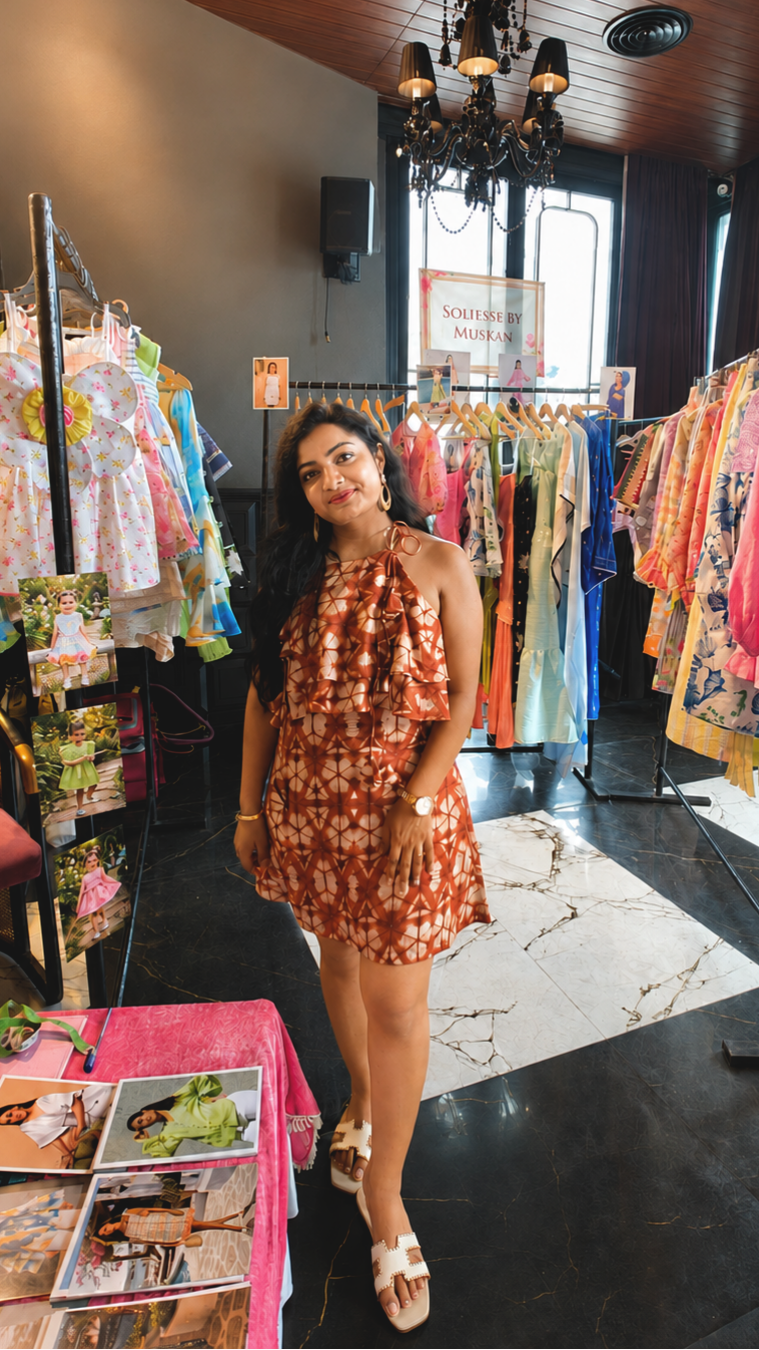 founder wearing boho halter tie dye dress