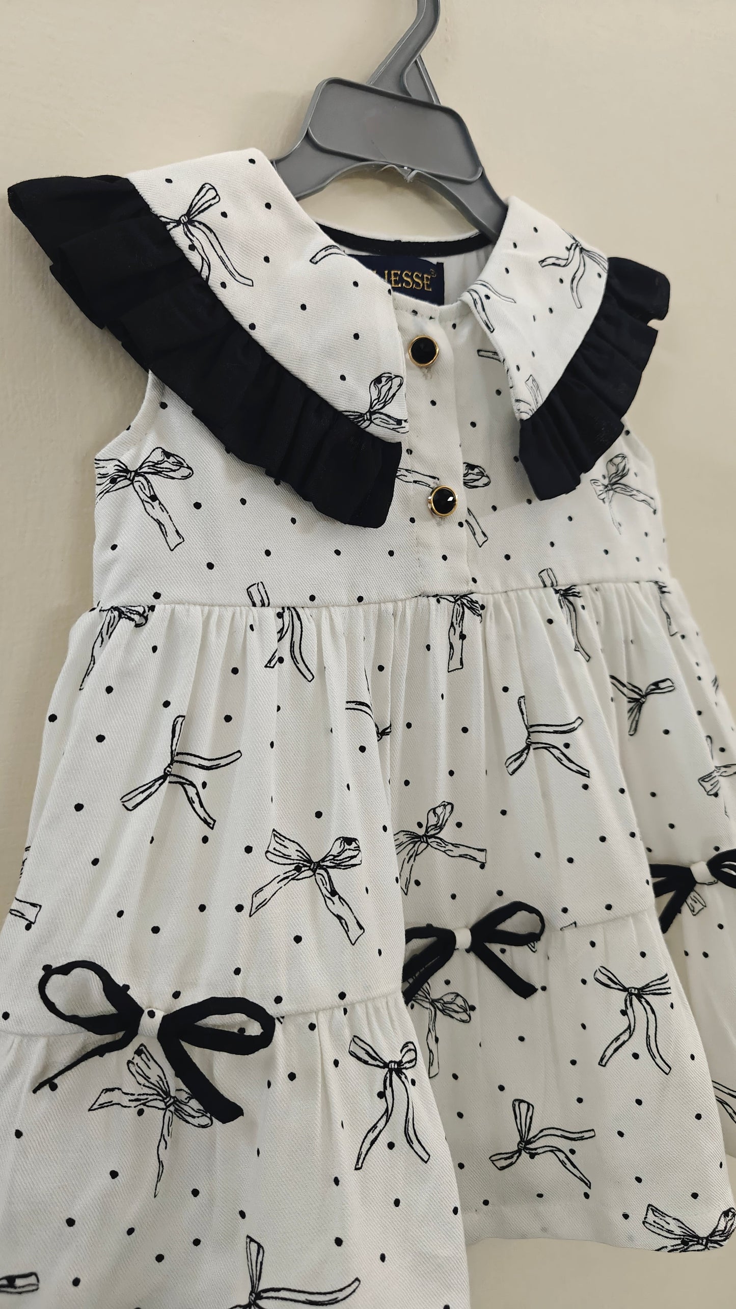 close up view of polka bow kid dress, summer dress, cute look.