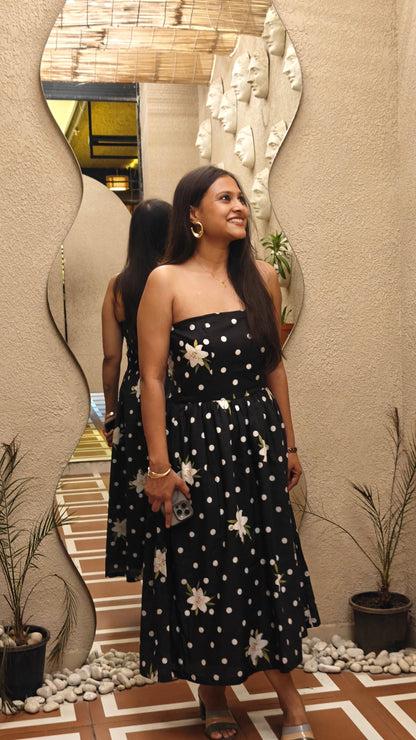 Women in black color polka dot & floral printed off shoulder dress, evening look. Perfect for date nights, resort wear, getaways, dinner etc. Fitted till wiats then flared out.