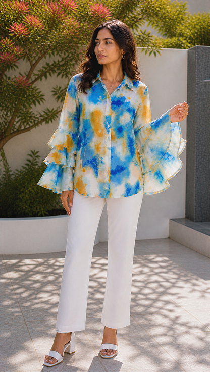 tie dye cotton voile shirt with button down placket and ruffle sleeves, movement of 3 layered ruffle sleeve can be seen.