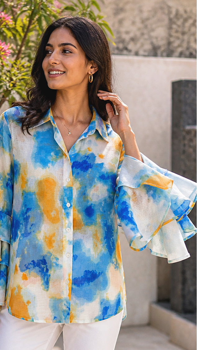 CLOSE UP OF THE TIE DYE SHIRT HAND MOVEMENT OF SLEEVE.